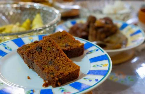 2 slices of delicious home-made fruit cake on plate. Stock Photos
