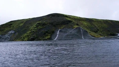 2 Small Waterfalls Flowing Into River, Remote Wilderness Of Iceland Stock Footage 82563910