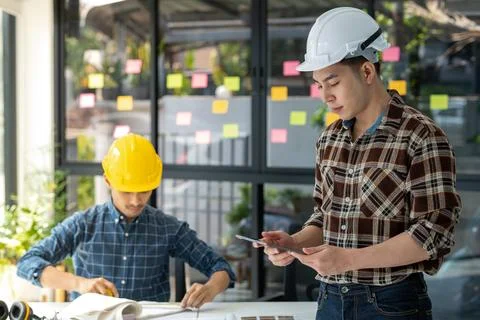 2 smart engineer discussion before work Stock Photos