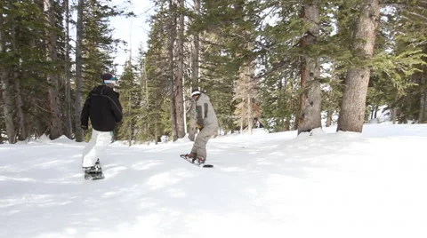 2 Snowboarders in Forest Stock Footage 44306725