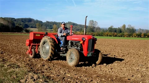 2. Sowing. Seeder for sowing in a field. Tractor passes through the shot. 스톡 동영상 43159484