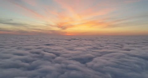 #2 Sunset/Golden Hour/Cloudscape - Sunset above a thick layer of moving clouds Stock Footage 252036795