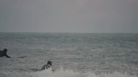 2 surfers heading out to surf on big waves at Bradford beach Lake Michigan Video stock 166255159