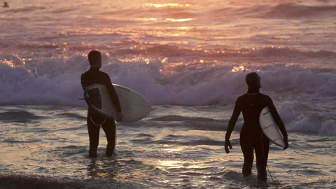 2 surfers in Surf Sunset evening in wild ocean, Basque Country Video stock 152637689