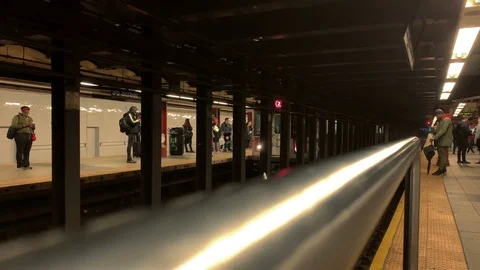 2 train pulling into station from across platform tracks in subway station NYC Stock Footage 108197312