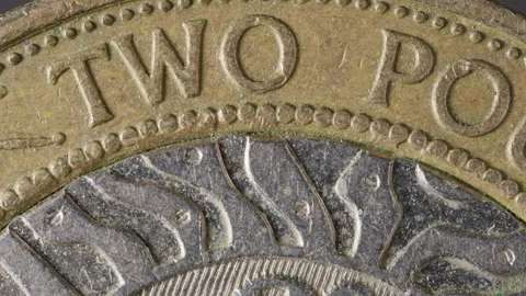 £2 / Two British Pound (GBP) coin - slow rotate - Super Macro 4K Stock Footage 280925204