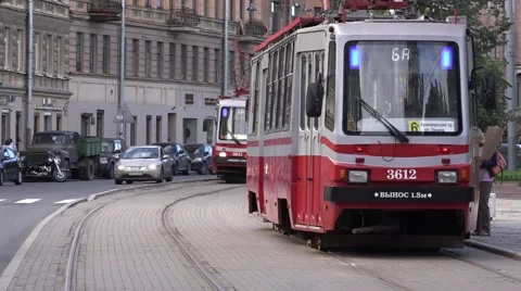 2 two-sided oncoming trams meet at sideway segregation Stock Footage 67468159