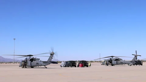2 UH60 Blackhawks Preparing for Take Off Stock Footage 154269252