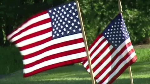 2 US Waving Flags on Ground (Memorial Day) Stock Footage 592610