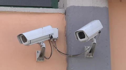 2 white security outdoor cameras Stock Footage 50856020