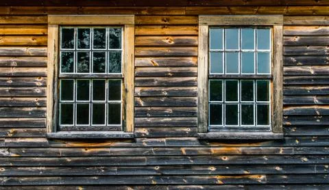 2 windows in wall of charred colonial building Stock Photos