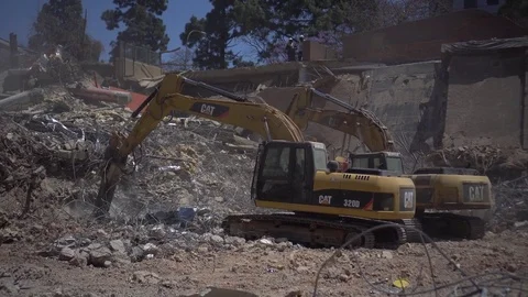 2 x Excavators breaking ground with Pecker Stock Footage 82066456