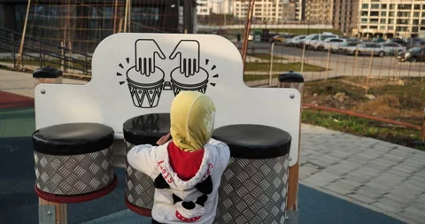 2-Year-Old Boy Nervously Approaches Gigantic Drums in City Park Видео 241358703