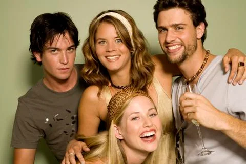 2 young couples smiling for the camera Stock Photos