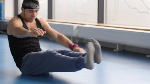 2 Young strong man workout doing push-ups with twist on the floor in gym Stock Footage 101057559