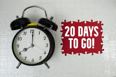 20 Days To Go! text with alarm clock on red background Stock Photos