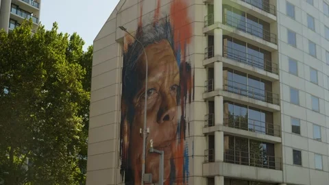 20 meter mural of Aboriginal elder Jenny Munro on Sydney apartment block 6K Stock Footage 300913579