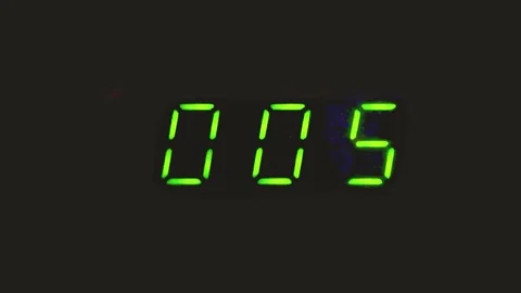 20 seconds on a digital timer on a black background with natural flickering.. Stock Footage 306299280