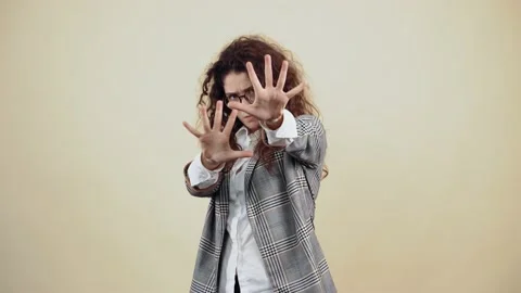 The 20-year-old says stop with both hands in front. Cretaceous in gray jacket Stock Footage 150435526