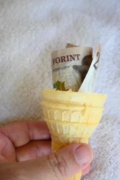 2000 forint banknote in an empty ice cream cone Stock Photos