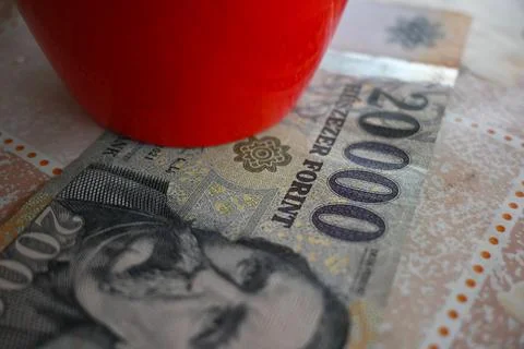 2000 Hungarian forint note under a red cup Stock Photos