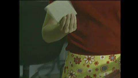 2000s: Man hands model plane components to girl. Girl speaks. Man speaks and Stock Footage 129277692