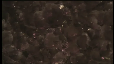 2000s: UNITED STATES: example of amethyst. Man talks to girl about geode. Stock Footage 119505058