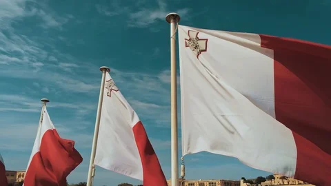 20.03.2019/Malta - Flying through a Maltese flags right on to Valletta city. Video stock 127001680