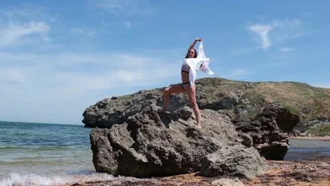 20.05.2021. Sochi. Summer Olympic Games in Tokyo. Man with a flag on the beach Stock Footage 158061024