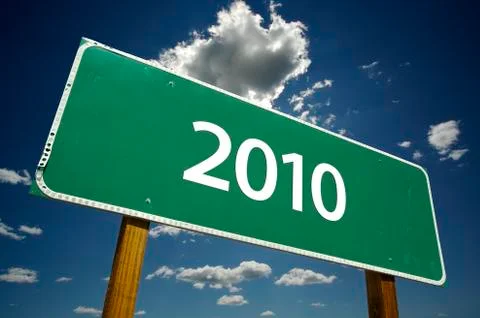 2010 Road Sign with dramatic clouds and sky. Stock Photos