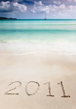 2011 write in the sand of a tropical beach Stock Photos