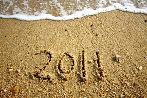 2011 written on sand Stock Photos