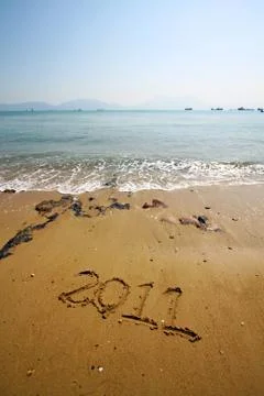 2011 written on sand Stock Photos