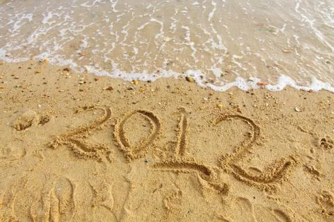 2012 handwritting on sand Stock Photos