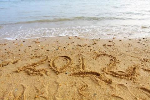 2012 handwritting on sand Stock Photos