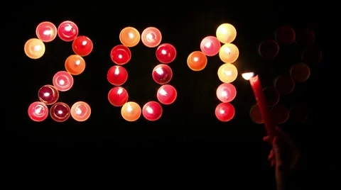 2012 made ​​of colored candles on a black background Stock Footage 8849431
