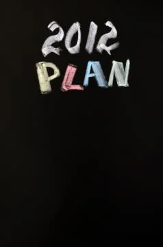 2012 new year plan written on blackboard Stock Photos