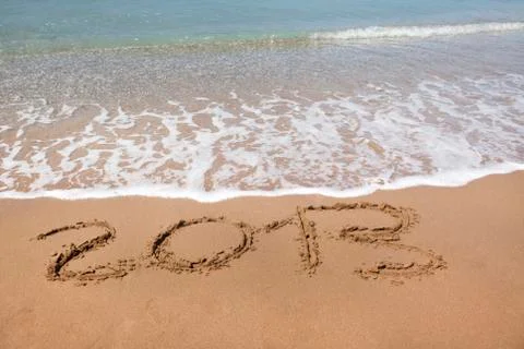 2013 year wrote on the beach Stock Photos