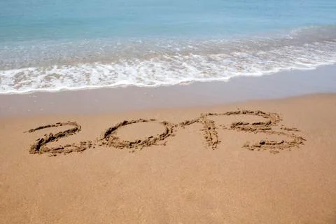 2013 year wrote on the beach Stock Photos