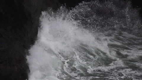 20130103101006 Slow Motion Wave Crashes Against Sea Cliff Stock Footage 217744182