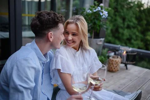 A young couple clinking with wine outdoors, weekend away in tiny house in countryside, sustainable living. xkwx love, wine, couple, woman, man, outdoor, happy, terrace, romance, romantic, together, young, drink, glass, person, smiling, caucasian, celebration, lifestyle, garden, party, relationship, two, alcohol, cheerful, vacation, tourism, closeness, date, honeymoon, newlyweds, lover, positive, togetherness, drinking, champagne, evening, holding, tiny house, holiday, nature, off beat, relax, meditation, digital detox, candle, hygge, travel, weekend away