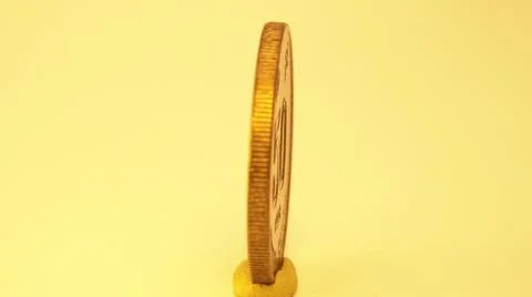 2014:.Coin On Table Spinning In Circle Stock Photos