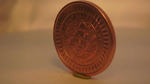2014:.Rotating Copper Colored Coin Stock Photos