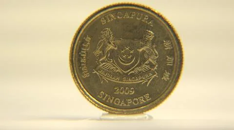 2014:View Of Five Cent Coin Rotating Around Vertical Axis On White Surface 写真素材