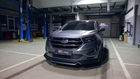 2015 Ford Edge gray sport. sports car cover tuning. on the technical service Stock Footage 105171253