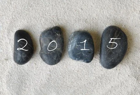 2015 on pebbles Stock Photos