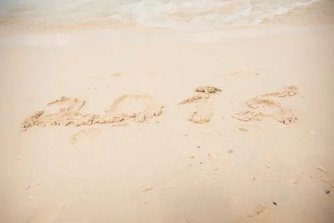 2015 write on white sand Foto stock