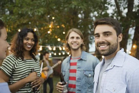 Portrait of smiling friends enjoying outdoor party, Party Farm xkwx caucasian, ethnicity, smiling, standing, portrait, looking, at, camera, incidental, people, enjoyment, friendship, holding, four, beard, hanging, out, togetherness, outdoors, casual, clothing, bonding, happiness, dinner, party, celebration, copy, space, mid, adult, young, dusk, 30-34, years, 25-29, drink, farm, focus, on, foreground, leisure, activity, lifestyles, men, women, beer, bottle, multi-ethnic, group, social, gathering, calgary, alberta, canada, series