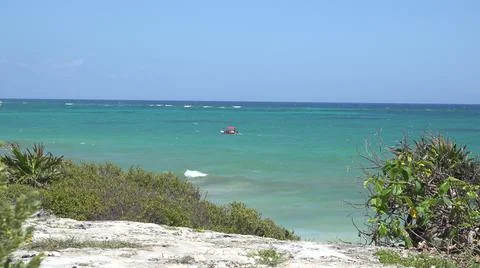 2015:TULUM MEXICO.Red Object Floating In Blue-Green Ocean Water On Sunny Day 写真素材