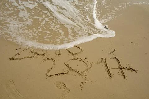 2016 and 2017 year on the sand beach Stock Photos